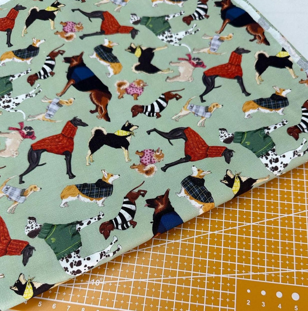 Dogs on green Print Woven Fabric