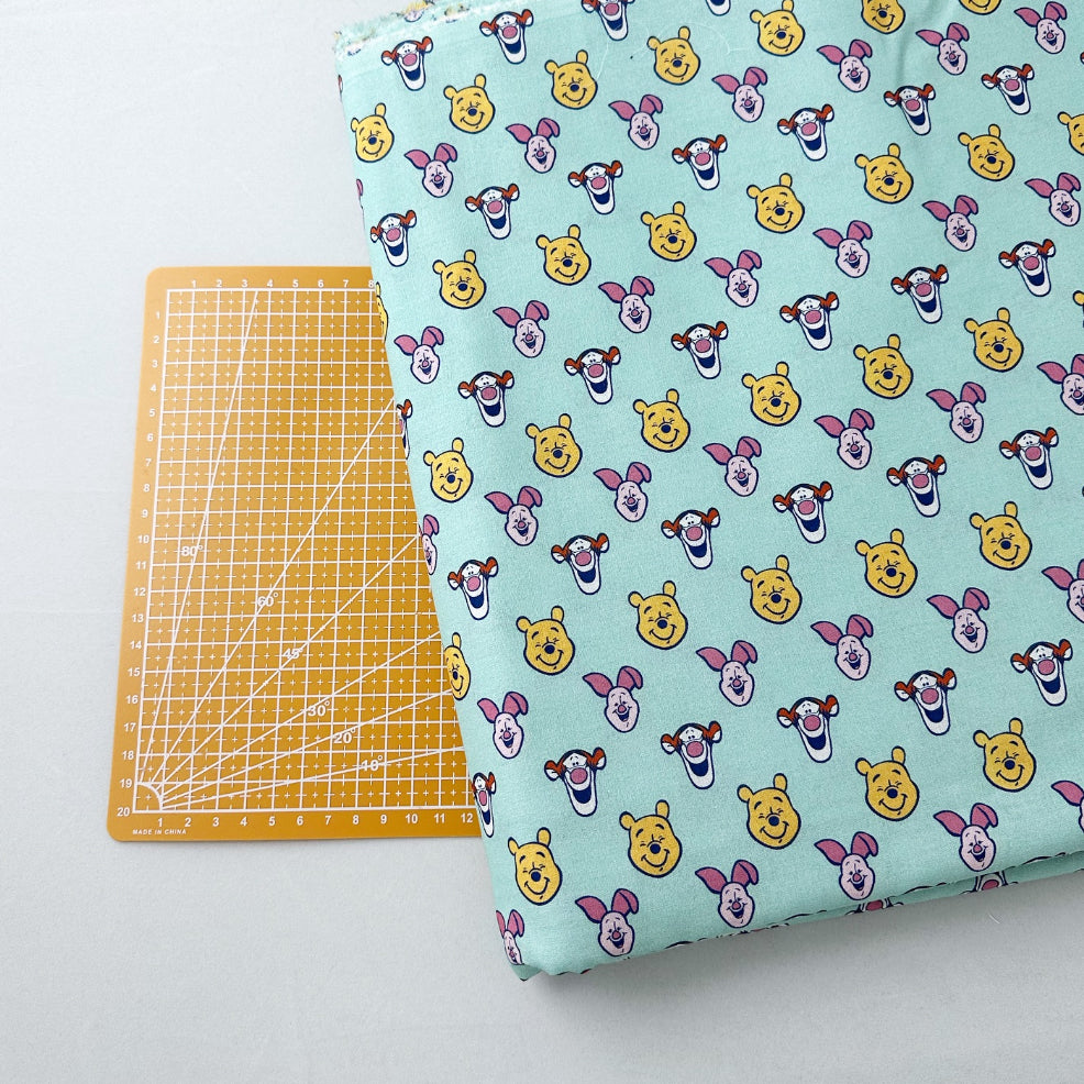 Pooh on Mint Print Woven Fabric
